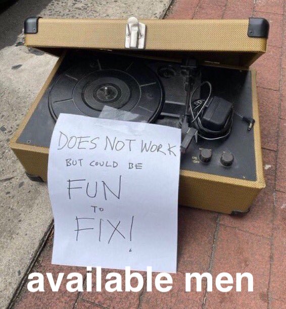 Curbside vinyl player with a sign: does not work but could be fun to fix! - captioned: available men